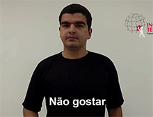 Imagem onde intérprete diz "Gostar-não", em LIBRAS